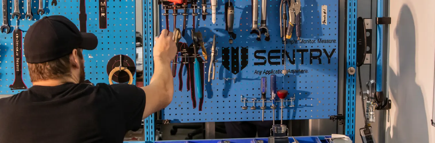 Sentry Worker Reaching for Tools