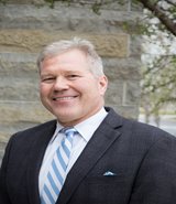 Headshot of author Brian Baker